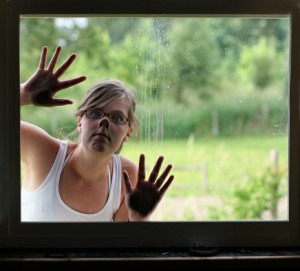 136560242-woman-peeking-in-window-gettyimages