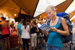 148938766-young-backpacker-checking-her-guidebook-in-gettyimages