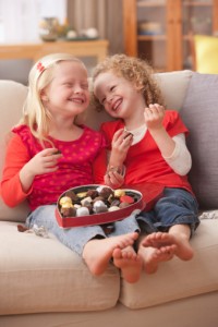 135538551-caucasian-girls-eating-valentines-candy-gettyimages