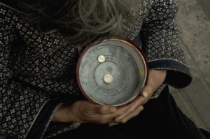 89039236-hangzhou-beggar-woman-holding-a-bowl-gettyimages