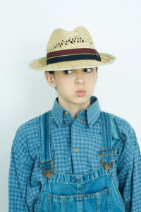 76152111-teen-girl-wearing-overalls-and-straw-hat-gettyimages