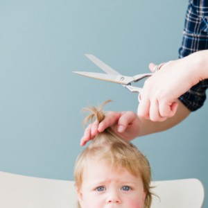 96827019-baby-girl-getting-haircut-gettyimages