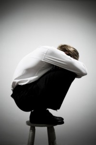 83358079-businessman-squatting-on-a-stool-gettyimages